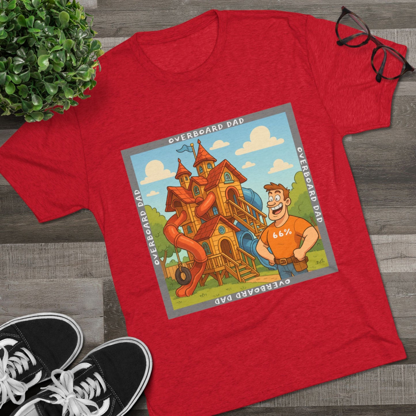 Funny cartoon dad standing proudly beside an enormous playhouse castle with slides, “Overboard Dad 66%” design on bright blue tri-blend t-shirt