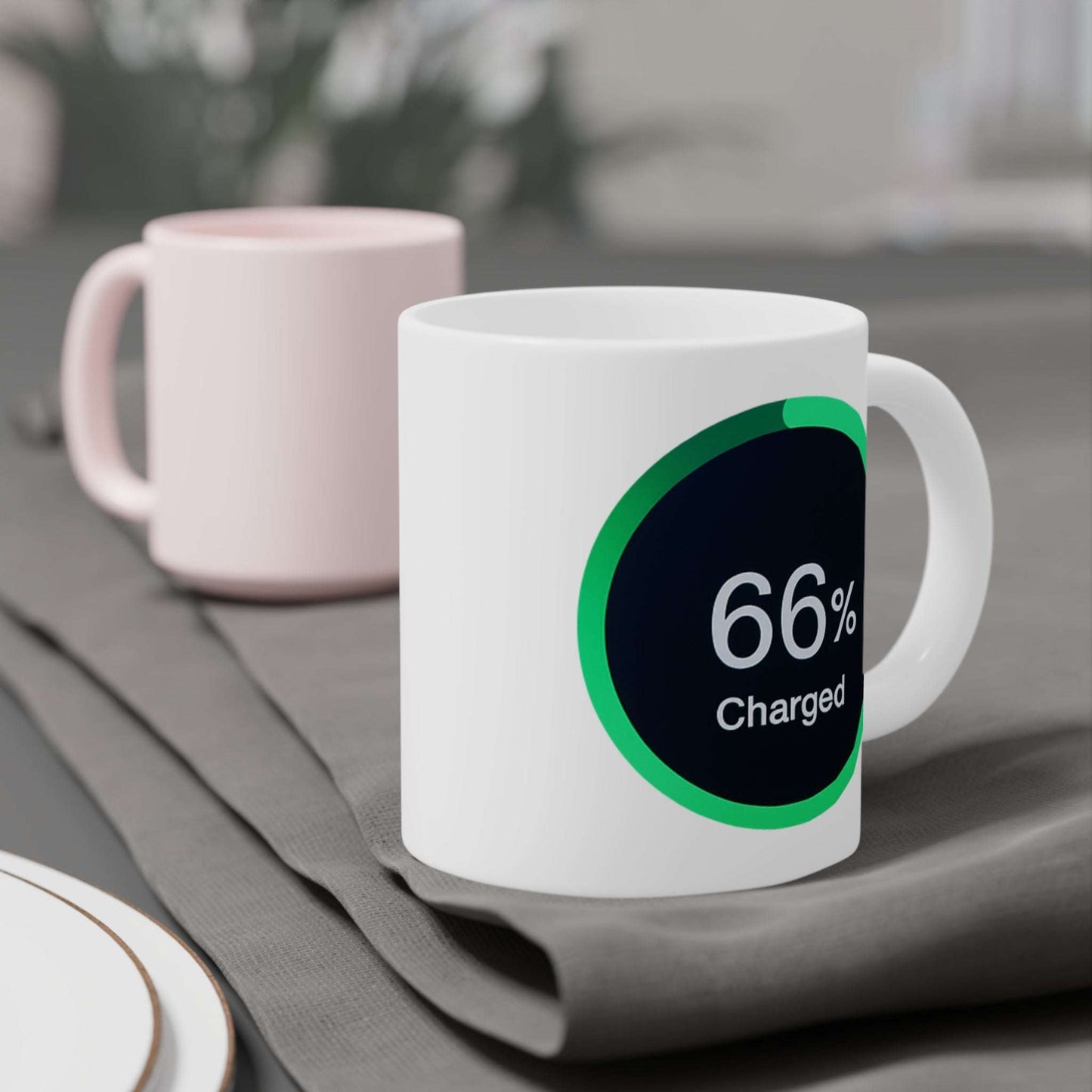 Mug displaying a green-ringed power meter icon reading 66% charged on a black background.