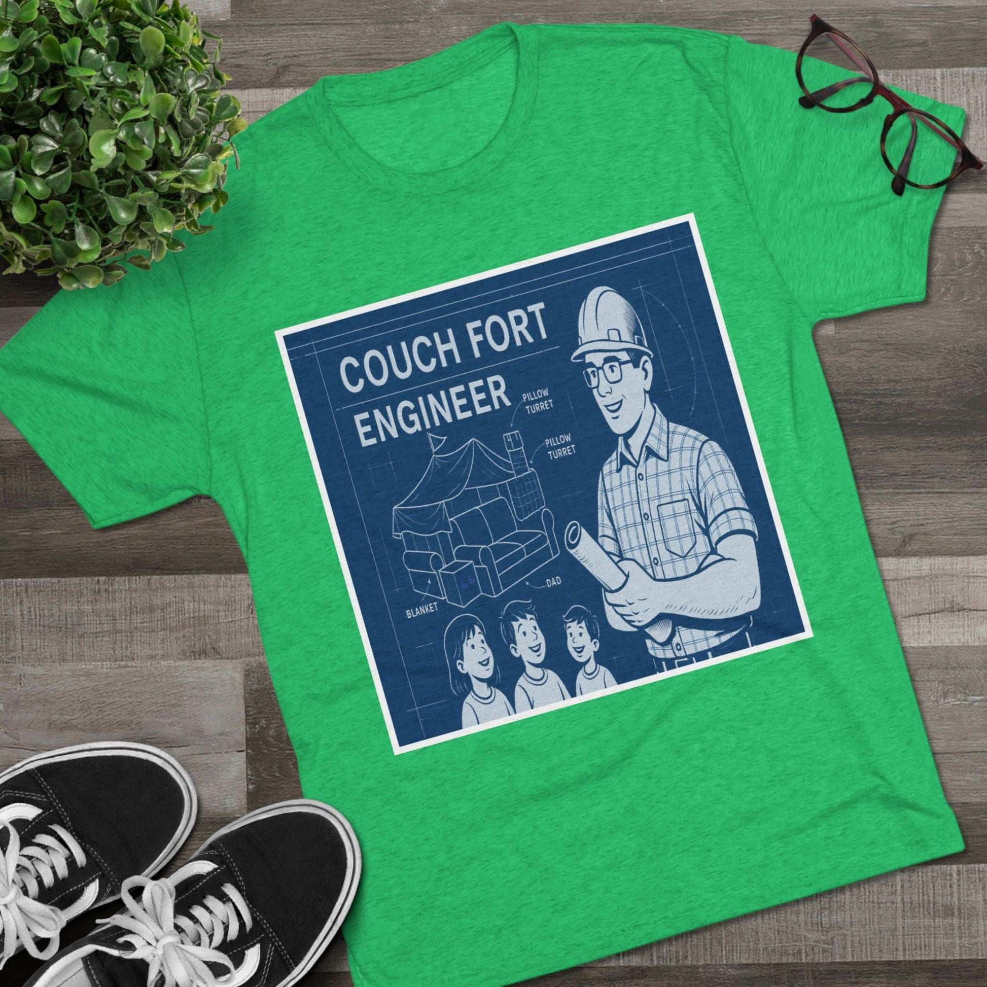 Couch Fort Engineer T-Shirt —Blueprint-style schematic of a couch fort with labeled pillows and blanket, plus a hard-hat dad holding plans.