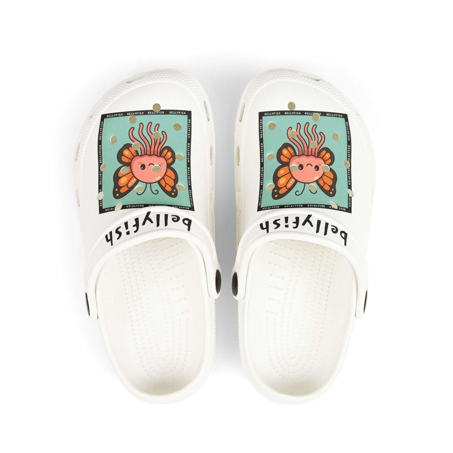 White slip-on clogs decorated with colorful Jibbitz: each shoe has a teal square graphic showing a cute jellyfish with butterfly wings and scattered gold dot accents, plus ‘Bellyfish’ branding on the straps
