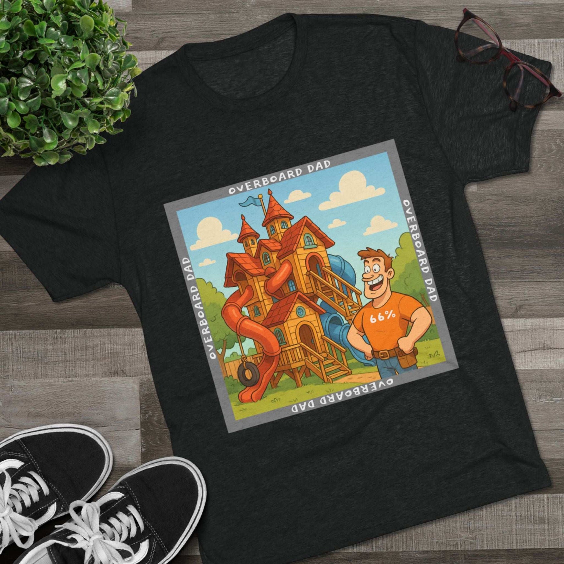 Funny cartoon dad standing proudly beside an enormous playhouse castle with slides, “Overboard Dad 66%” design on bright blue tri-blend t-shirt