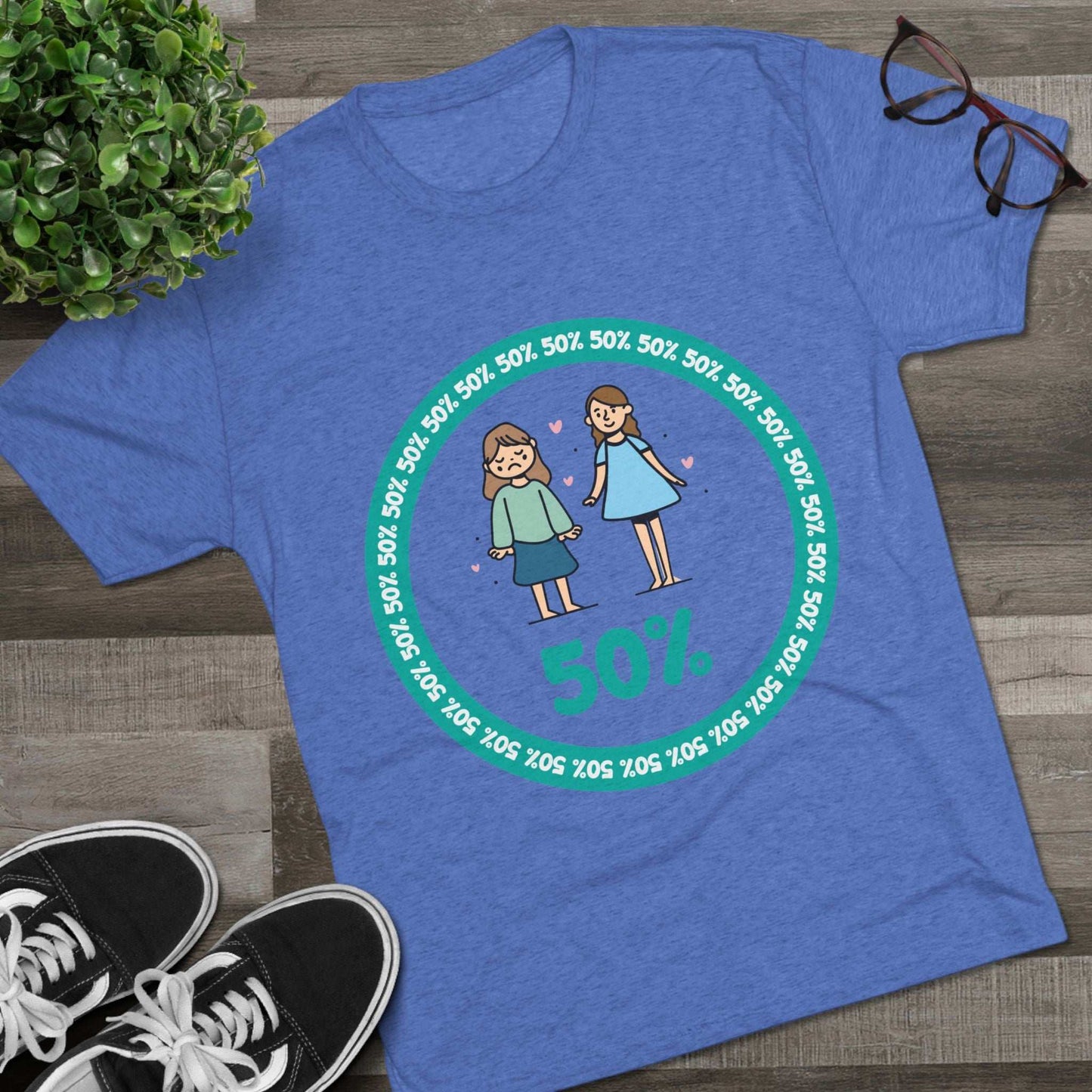 Original Girl Girl 50% Tri-Blend Tee — graphic t-shirt flat-lay, cartoon siblings inside teal 50% circle, repeating 50% pattern, bold 50% text, casual unisex style.