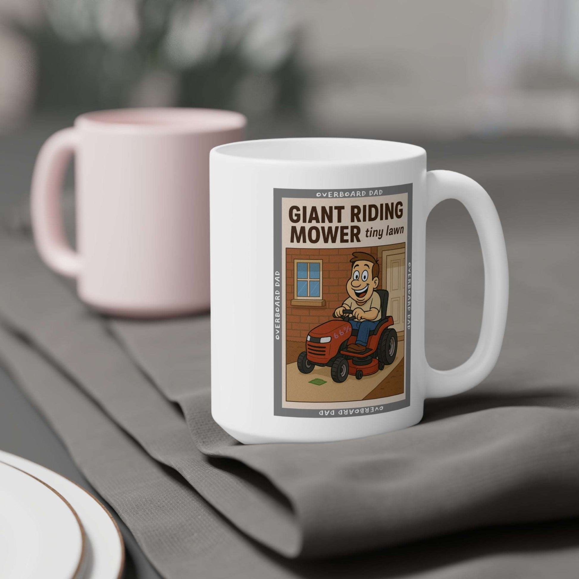 Humorous dad gift mug—white ceramic mug showing a bearded father on an oversized riding mower cutting a tiny strip of grass, ‘Overboard Dad’ top and bottom