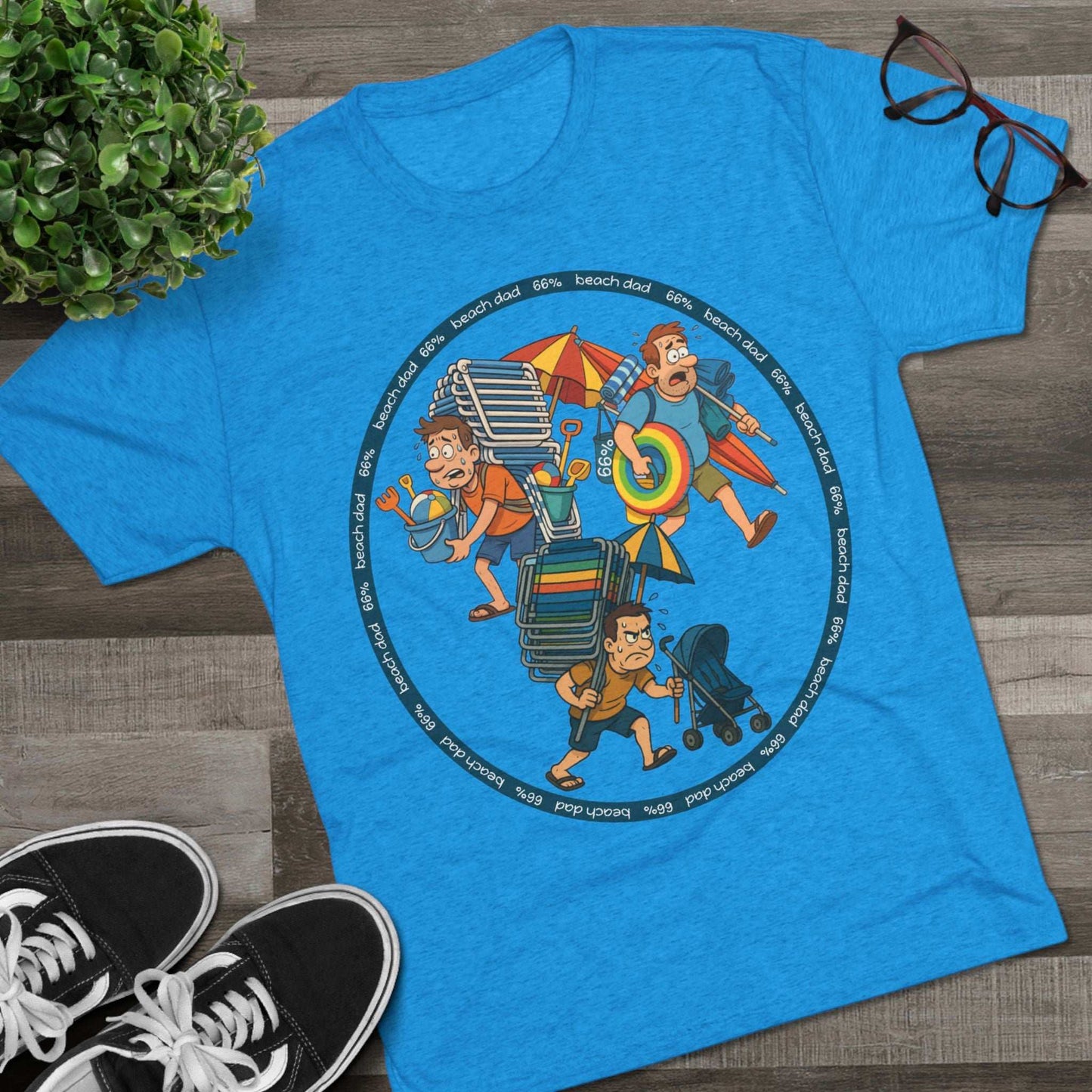 Cartoon dad overloaded with beach gear in three chaotic poses, “Beach Dad 66%” design on bright blue tri-blend tee – funny parenting shirt by 66 Percent