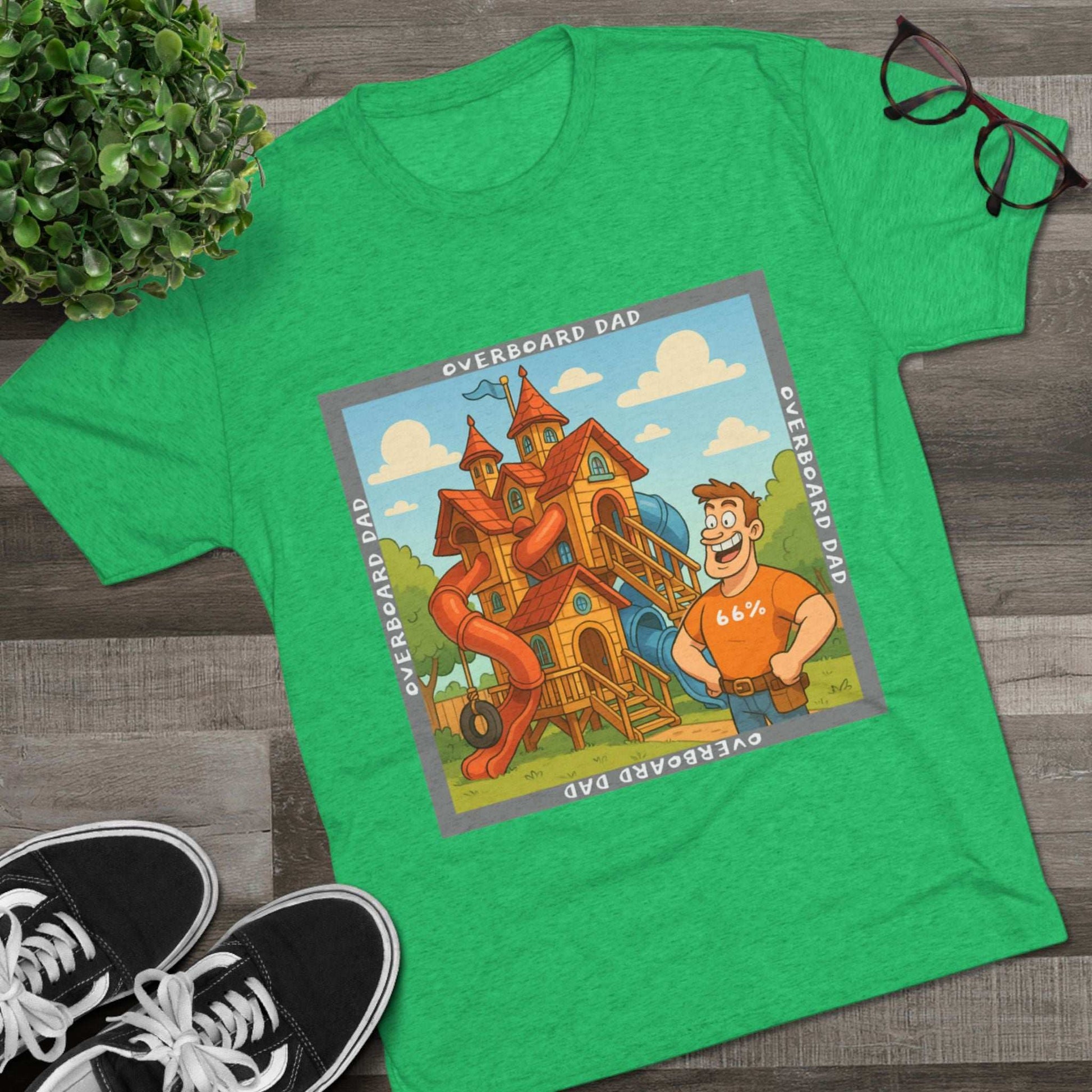 Funny cartoon dad standing proudly beside an enormous playhouse castle with slides, “Overboard Dad 66%” design on bright blue tri-blend t-shirt
