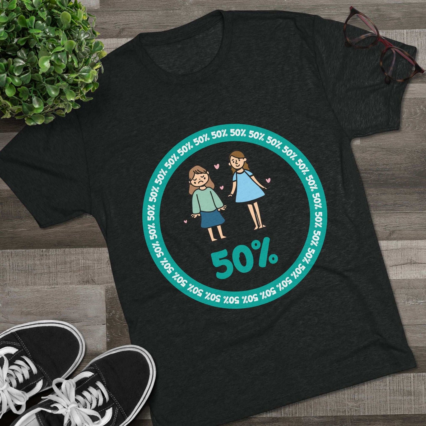 Original Girl Girl 50% Tri-Blend Tee — graphic t-shirt flat-lay, cartoon siblings inside teal 50% circle, repeating 50% pattern, bold 50% text, casual unisex style.