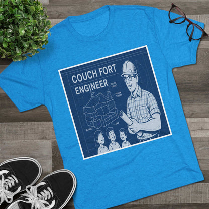 Couch Fort Engineer T-Shirt —Blueprint-style schematic of a couch fort with labeled pillows and blanket, plus a hard-hat dad holding plans.