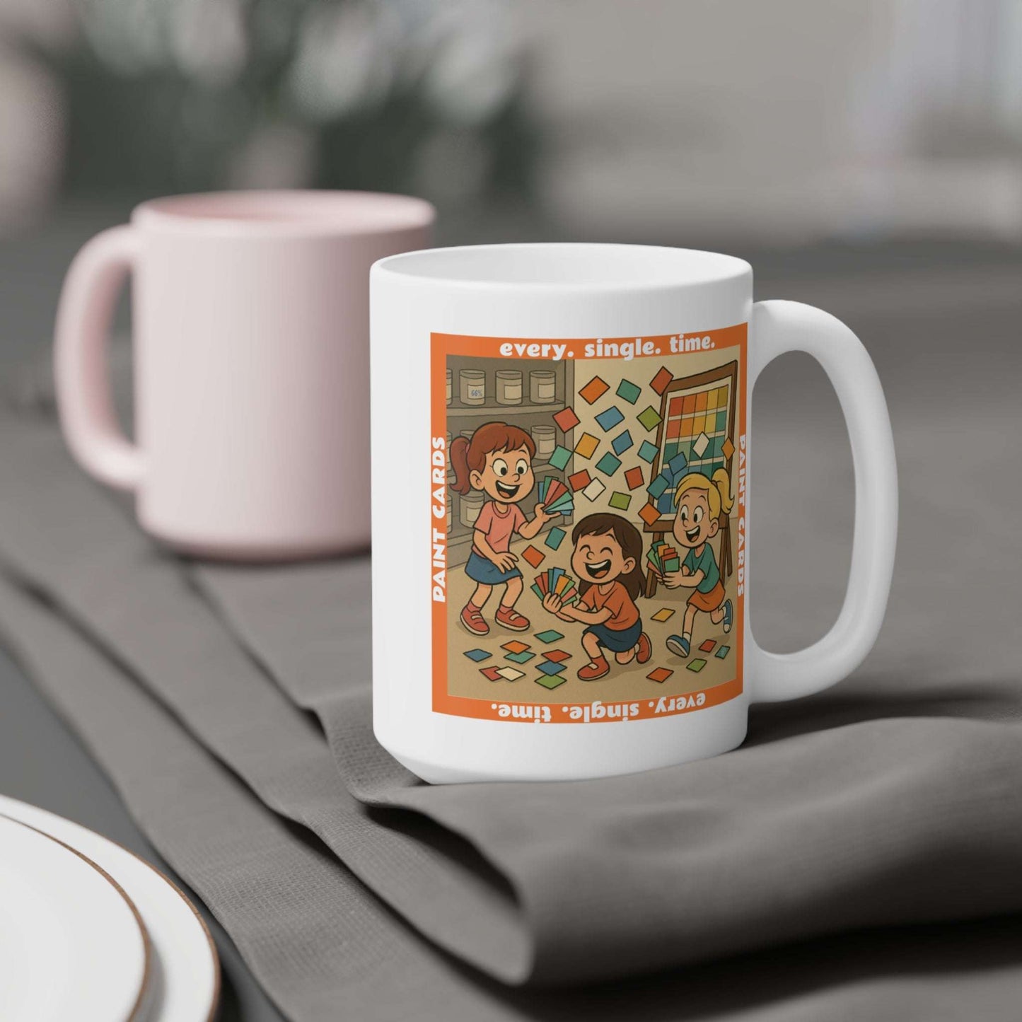 Coffee mug featuring a whimsical illustration of three children holding and tossing colorful paint sample cards in front of a paint shelf, with the text ‘every. single. time.’ and ‘Paint Cards’ framing the scene.