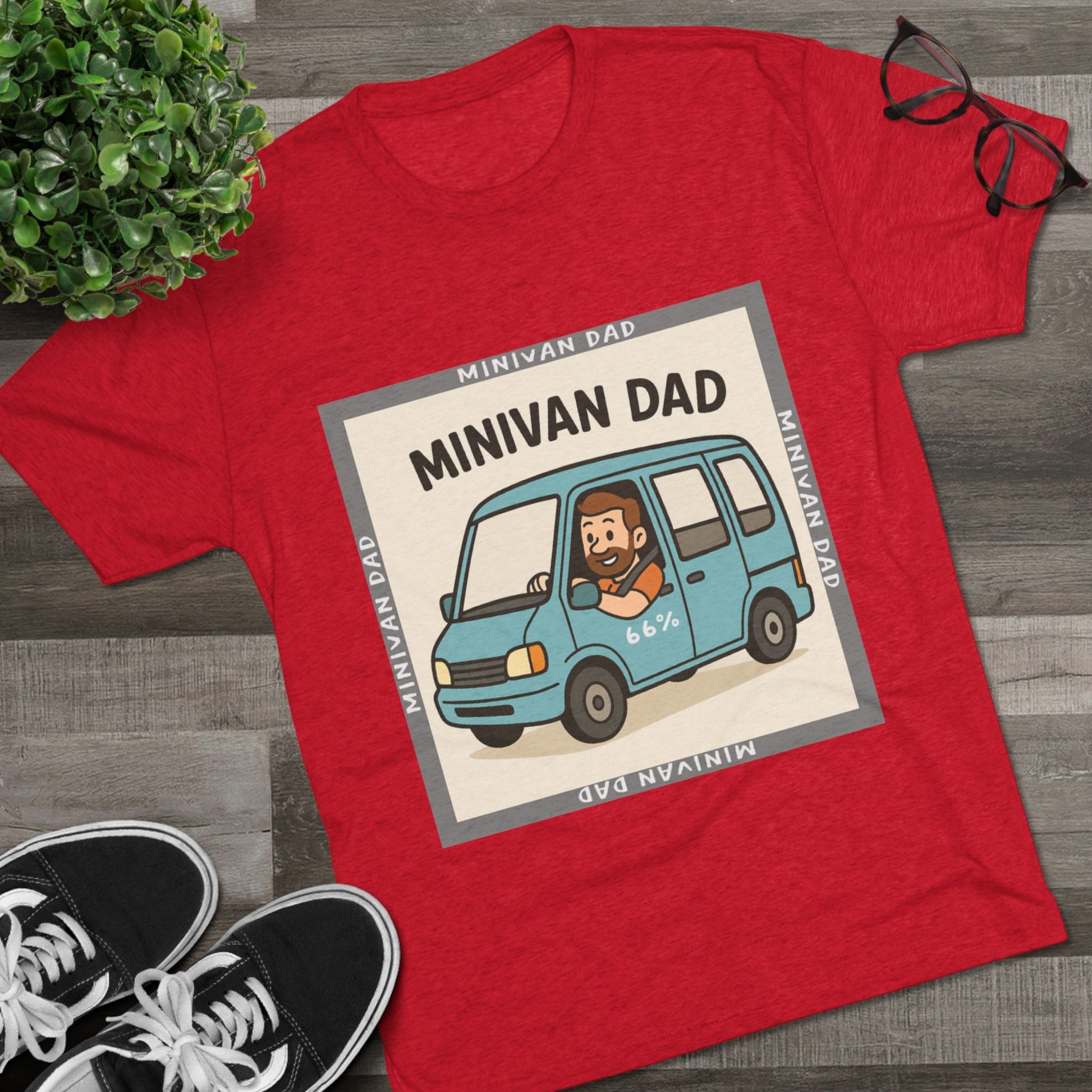 Minivan Dad 66% Tri-Blend Tee — graphic tee flat-lay, cartoon dad driving blue minivan, ‘66%’ decal, gray ‘MINIVAN DAD’ square border, casual unisex style.