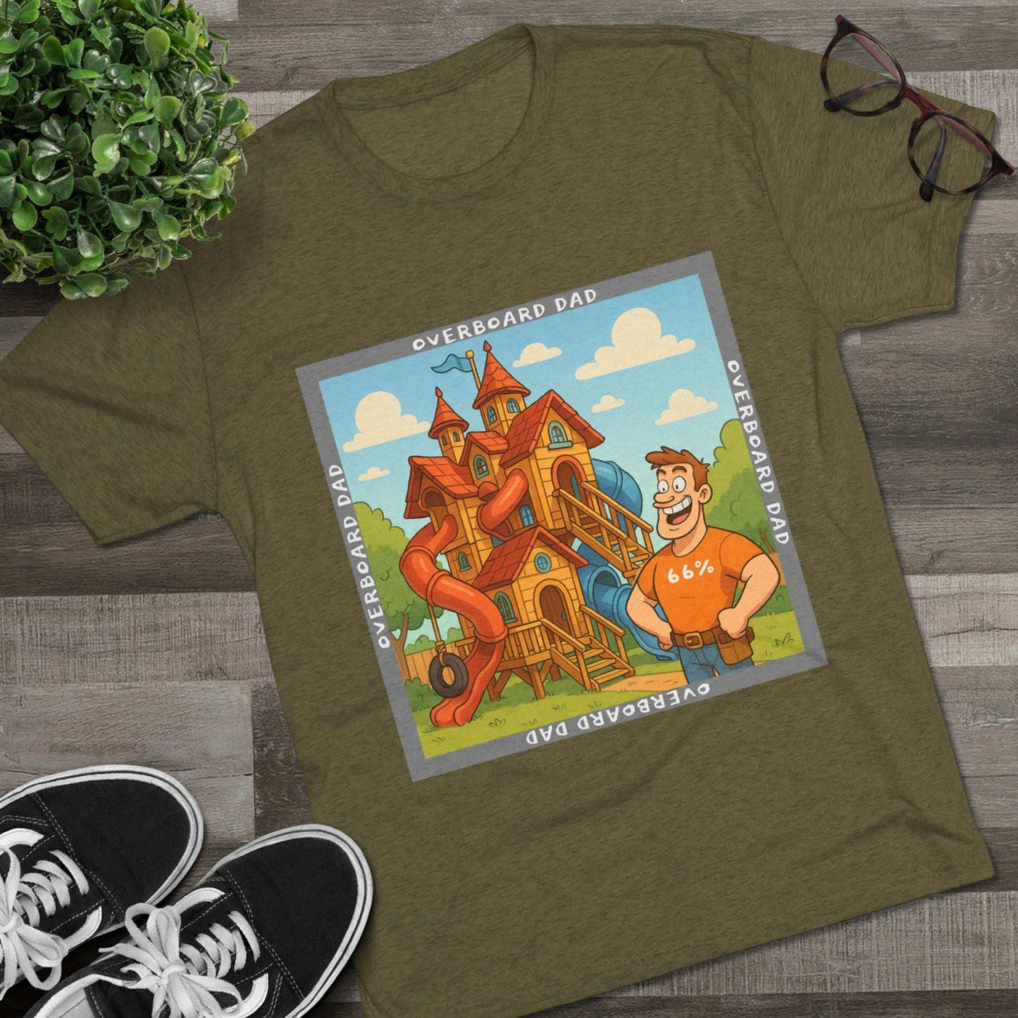 Funny cartoon dad standing proudly beside an enormous playhouse castle with slides, “Overboard Dad 66%” design on bright blue tri-blend t-shirt