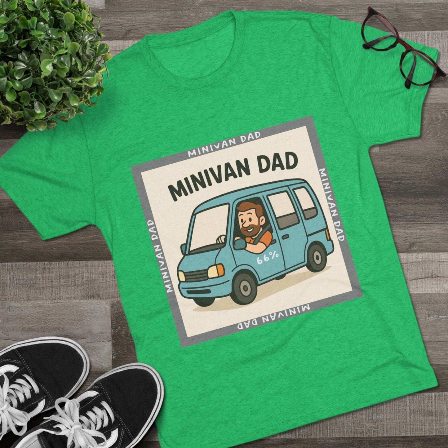 Minivan Dad 66% Tri-Blend Tee — graphic tee flat-lay, cartoon dad driving blue minivan, ‘66%’ decal, gray ‘MINIVAN DAD’ square border, casual unisex style.