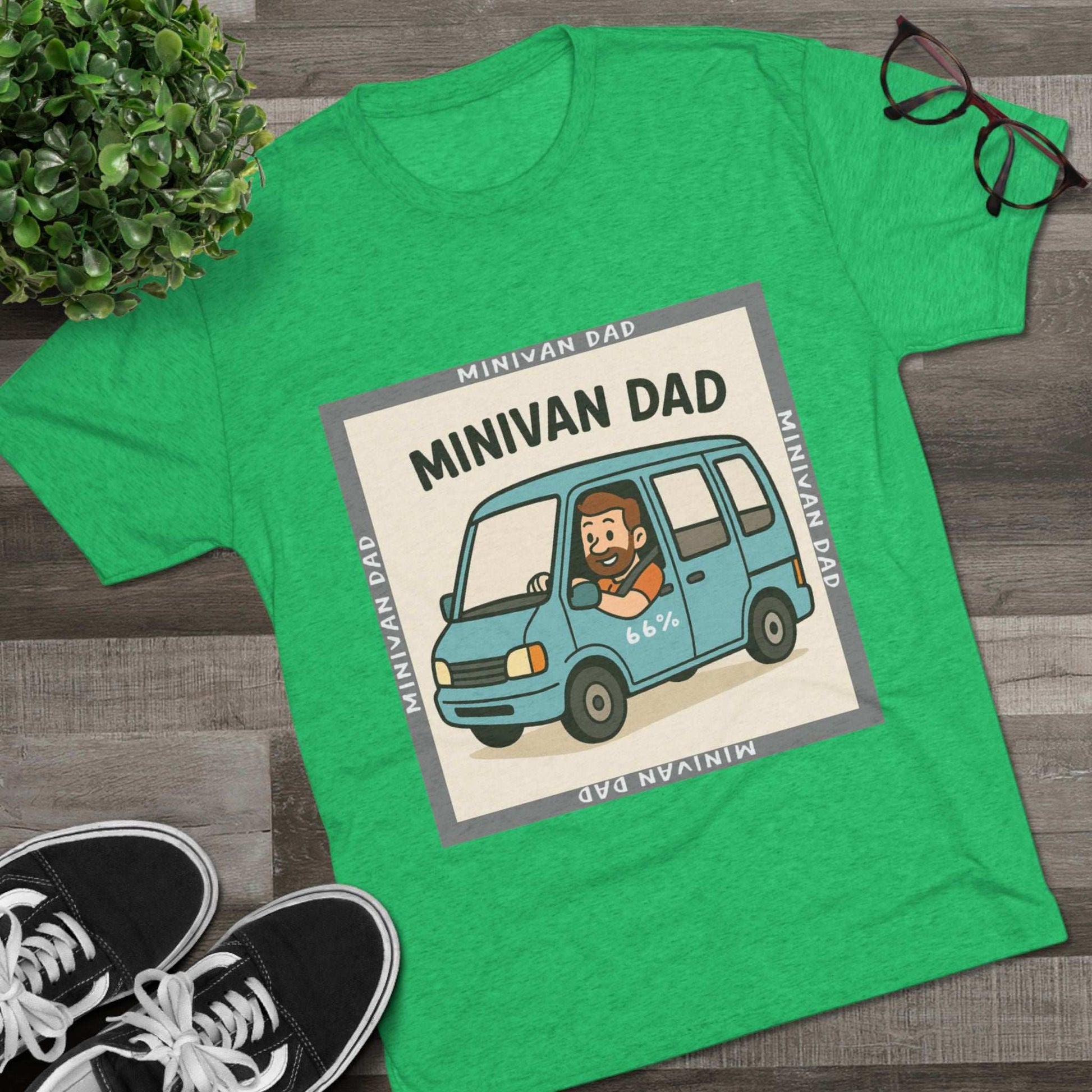 Minivan Dad 66% Tri-Blend Tee — graphic tee flat-lay, cartoon dad driving blue minivan, ‘66%’ decal, gray ‘MINIVAN DAD’ square border, casual unisex style.