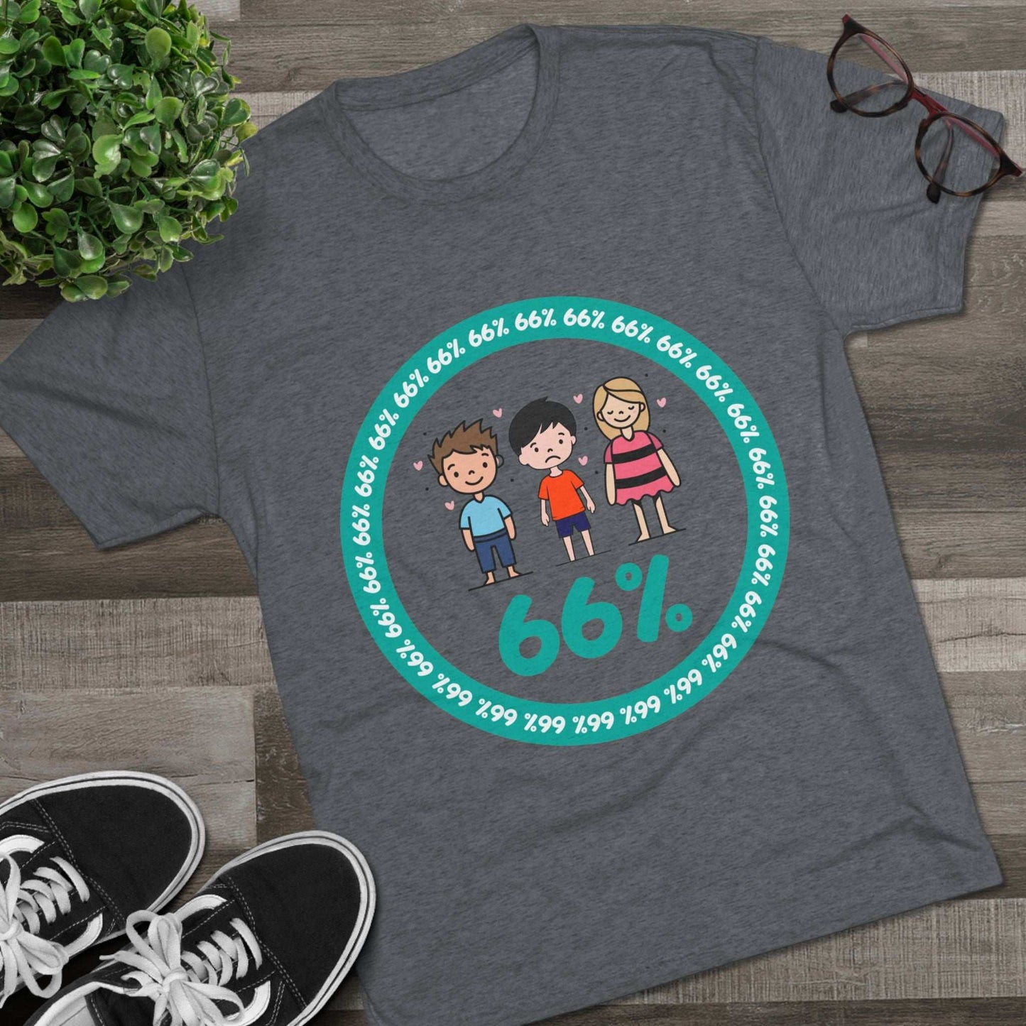 Flat-lay of tri-blend tee with two cartoon boys and one girl inside a teal 66% circle and repeating 66% border