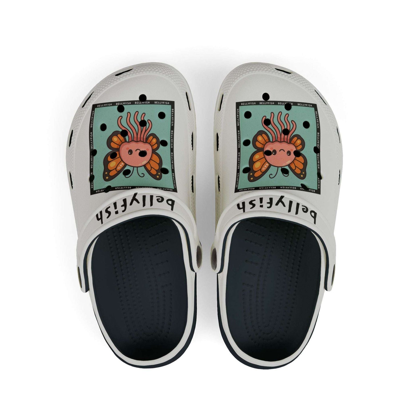 White slip-on clogs decorated with colorful Jibbitz: each shoe has a teal square graphic showing a cute jellyfish with butterfly wings and scattered gold dot accents, plus ‘Bellyfish’ branding on the straps