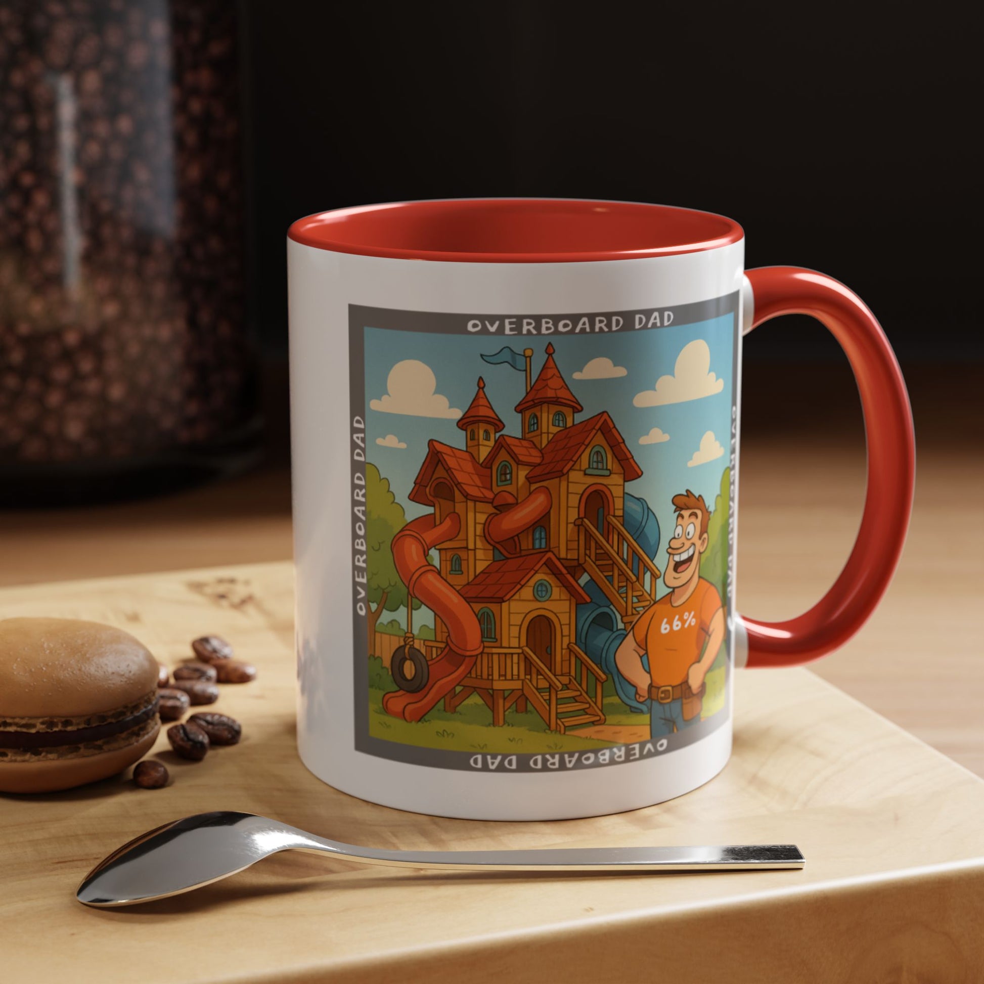 White ceramic mug printed with a cartoon dad wearing a ‘66%’ shirt standing beside a multi-level wooden playhouse with twisting slides, framed by the text ‘OVERBOARD DAD’.