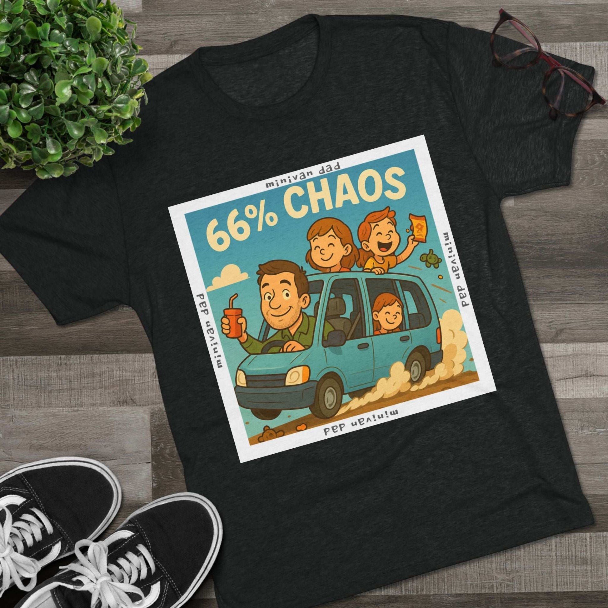 Cartoon dad driving minivan with three excited kids and snacks flying, “66% Chaos” design on dark heather tee – 66 Percent parenting apparel