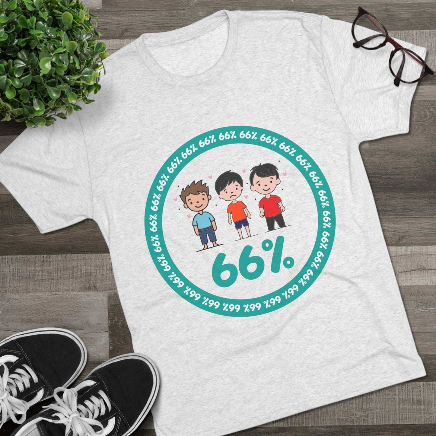 Flat-lay of tri-blend tee with three cartoon boys inside a teal 66% circle and repeating 66% border