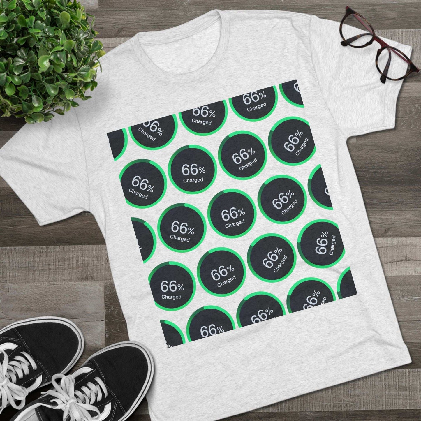 Retro 66% Charged Pattern Tee — tri-blend shirt, flat-lay battery gauge pattern, repeat “66% Charged” graphic, casual unisex style.