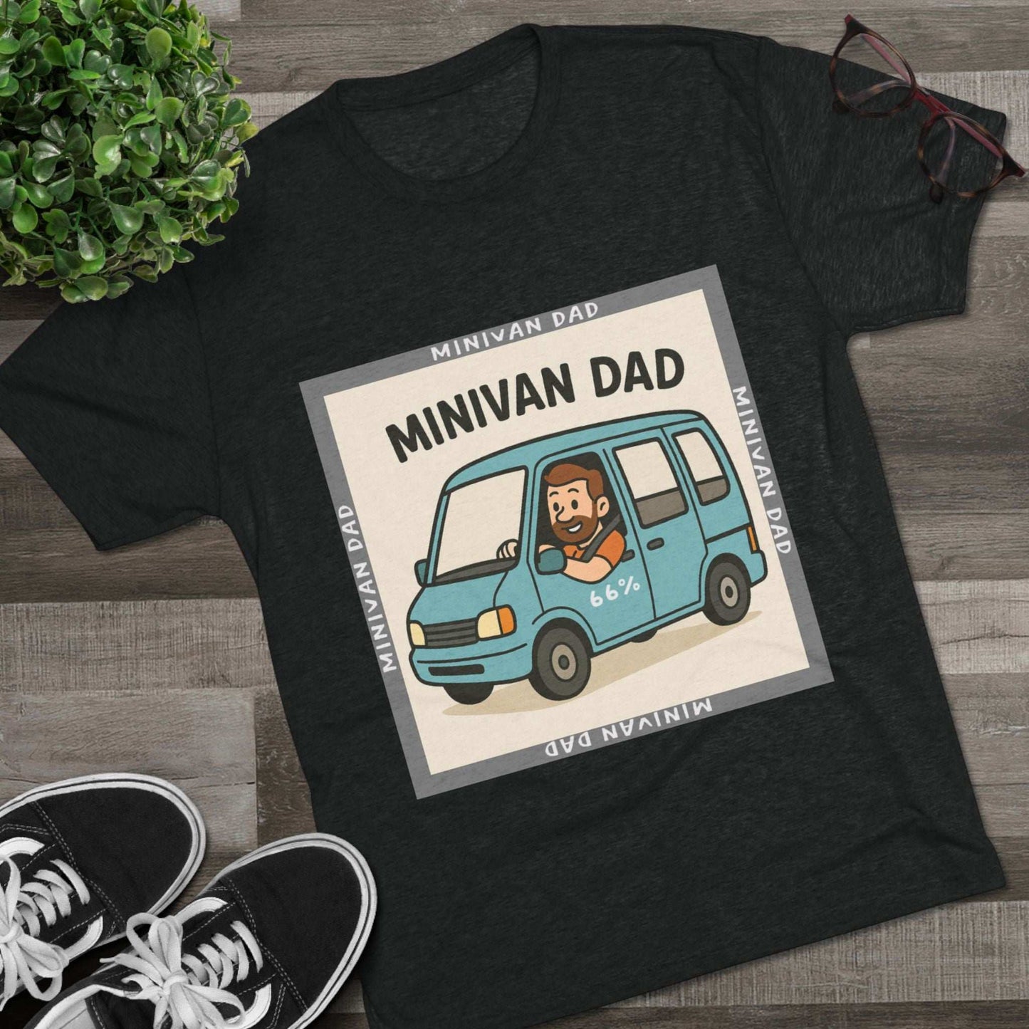Minivan Dad 66% Tri-Blend Tee — graphic tee flat-lay, cartoon dad driving blue minivan, ‘66%’ decal, gray ‘MINIVAN DAD’ square border, casual unisex style.