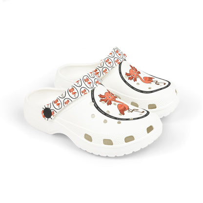 White rubber clogs worn with white-and-black striped socks, each shoe decorated with a round logo depicting a happy orange axolingo and the word ‘AXOLINGO’ repeated around the edge