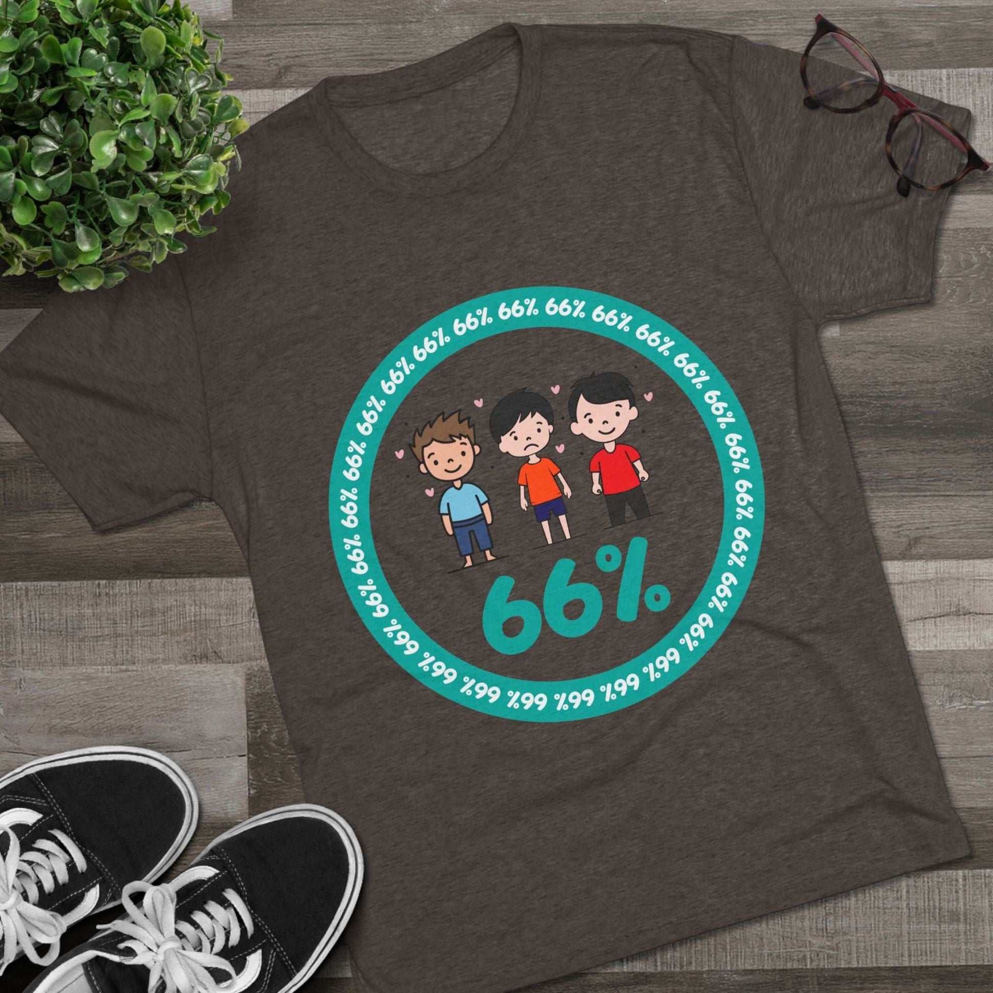 Flat-lay of tri-blend tee with three cartoon boys inside a teal 66% circle and repeating 66% border
