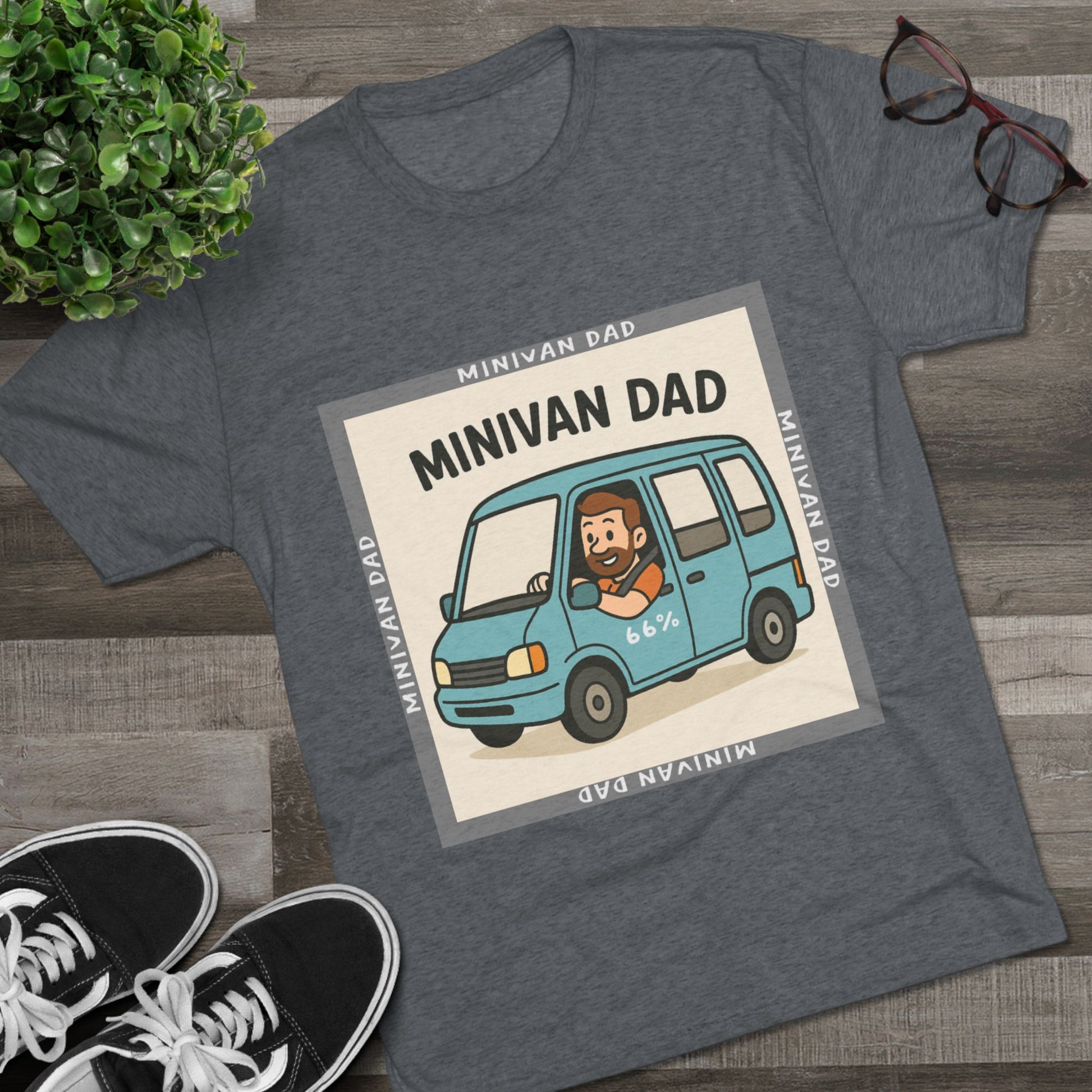 Minivan Dad 66% Tri-Blend Tee — graphic tee flat-lay, cartoon dad driving blue minivan, ‘66%’ decal, gray ‘MINIVAN DAD’ square border, casual unisex style.