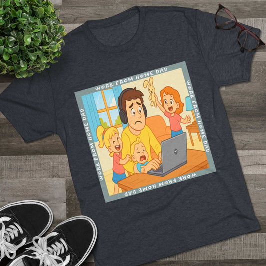 Work From Home Dad 66% Tri-Blend Tee — graphic tee flat-lay, cartoon dad with headphones typing on 66% laptop, three kids demanding attention, green WORK FROM HOME DAD square border, casual unisex style.