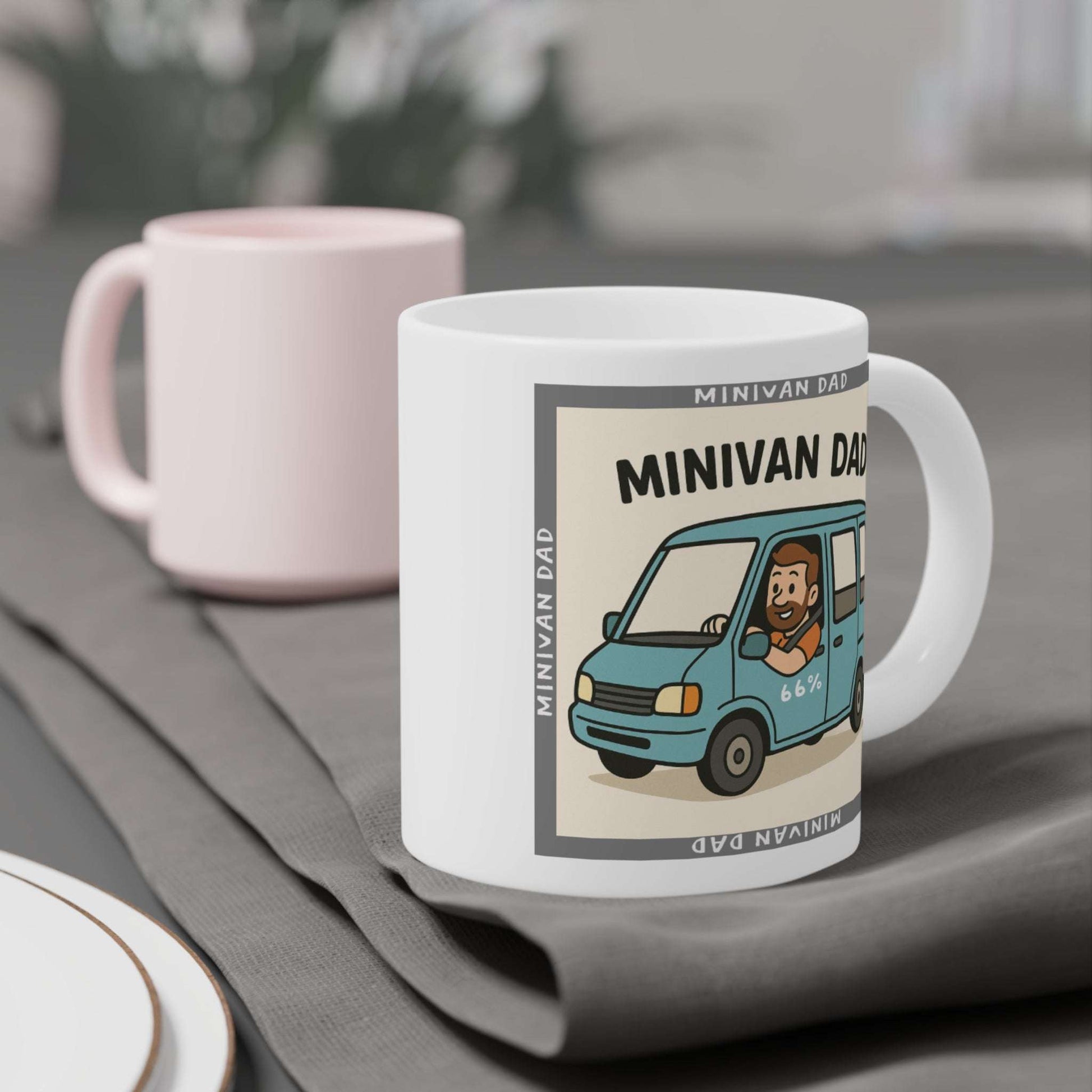 Novelty Minivan Dad coffee mug: white ceramic cup printed with a cheerful father behind the wheel of his minivan and repeating ‘Minivan Dad’ border text.