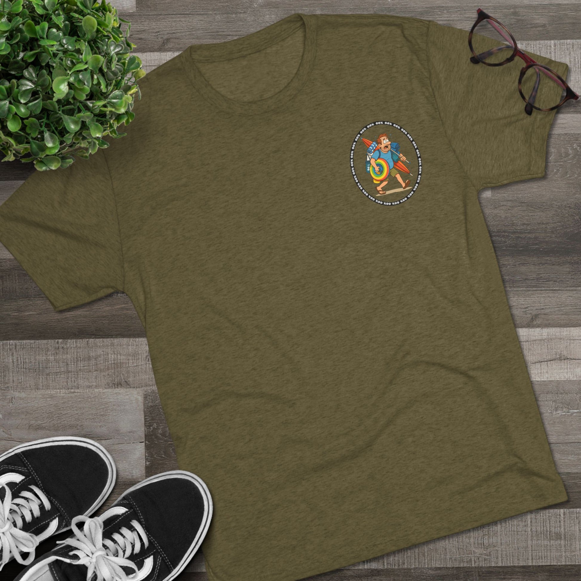 Tri-blend tee featuring large central circular graphic of overwhelmed ‘Beach Dad’ loaded down with chairs, umbrella, floatie and towels, with ‘66% beach dad’ ring