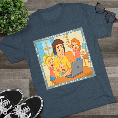 Work From Home Dad 66% Tri-Blend Tee — graphic tee flat-lay, cartoon dad with headphones typing on 66% laptop, three kids demanding attention, green WORK FROM HOME DAD square border, casual unisex style.