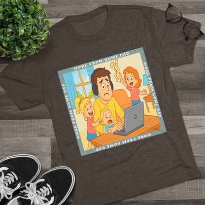 Work From Home Dad 66% Tri-Blend Tee — graphic tee flat-lay, cartoon dad with headphones typing on 66% laptop, three kids demanding attention, green WORK FROM HOME DAD square border, casual unisex style.