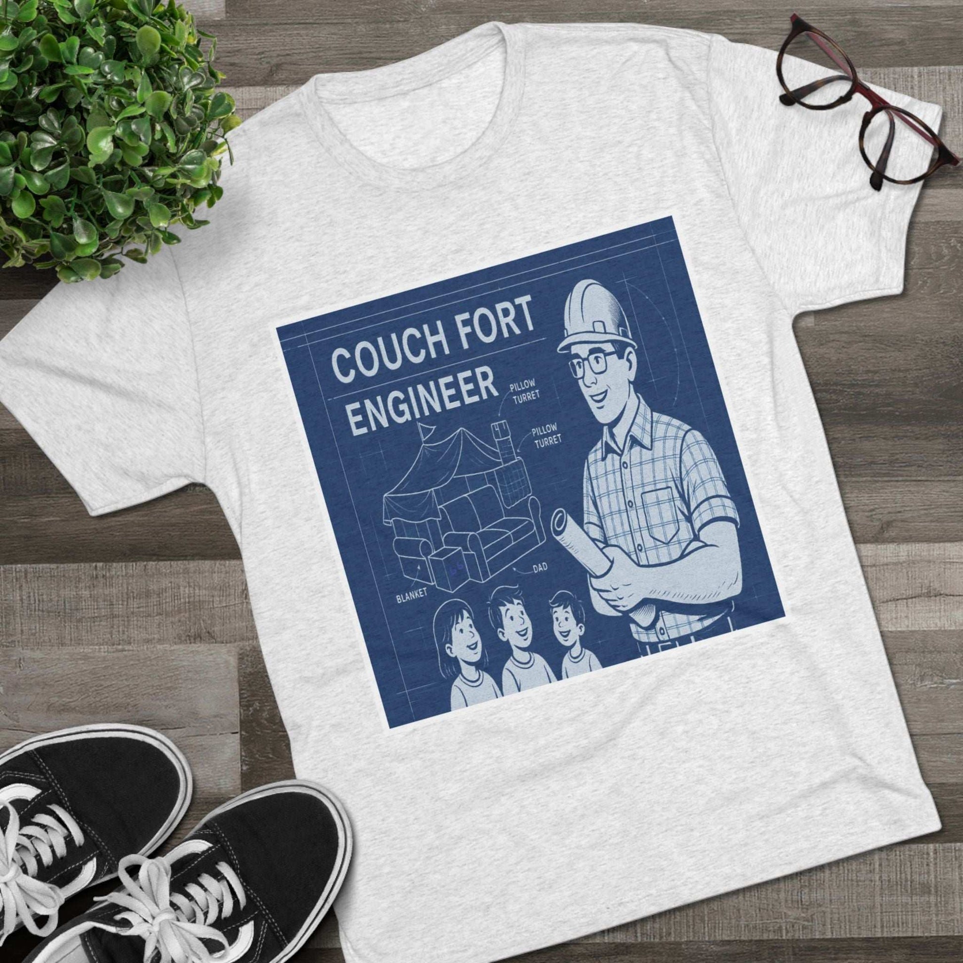 Couch Fort Engineer T-Shirt —Blueprint-style schematic of a couch fort with labeled pillows and blanket, plus a hard-hat dad holding plans.