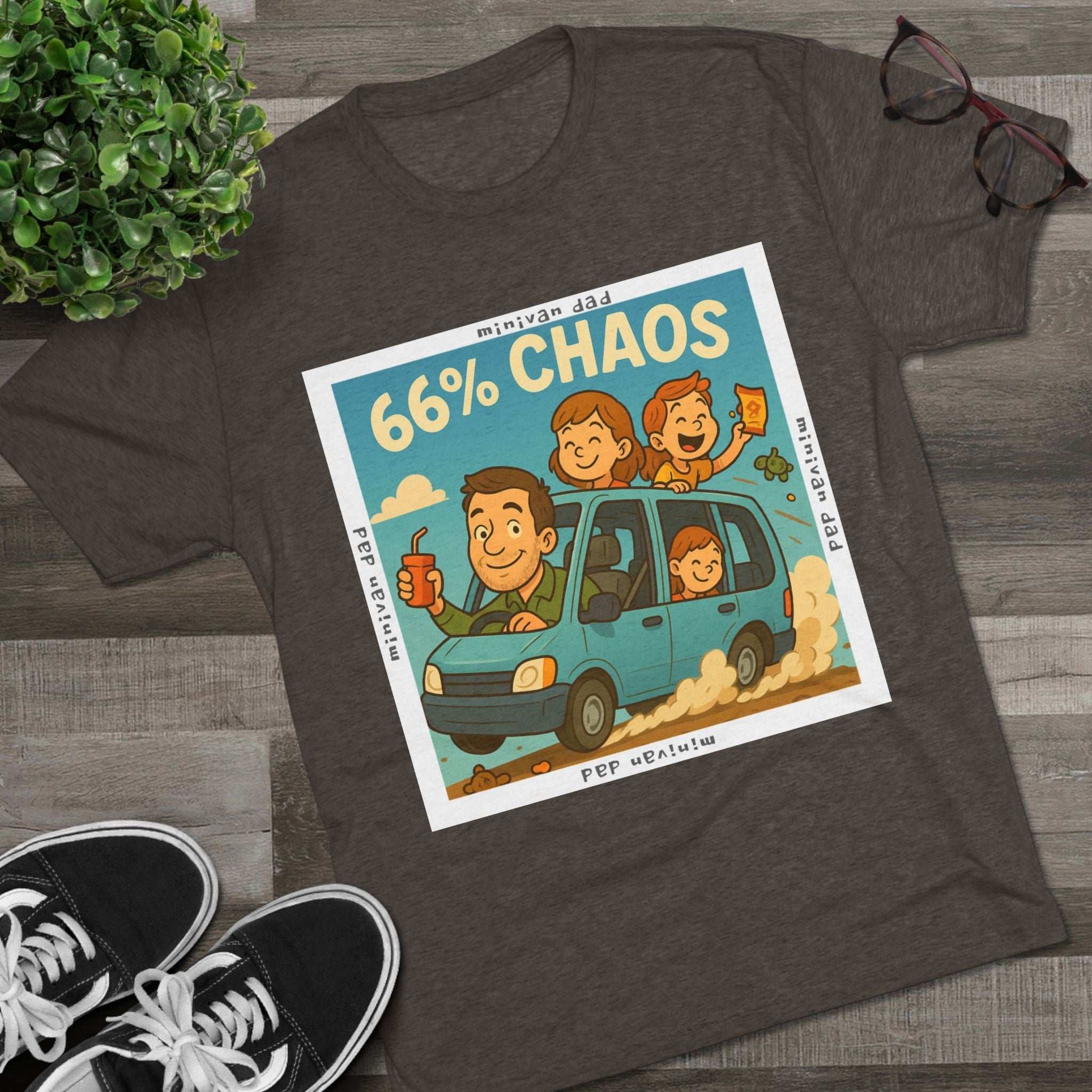 Cartoon dad driving minivan with three excited kids and snacks flying, “66% Chaos” design on dark heather tee – 66 Percent parenting apparel