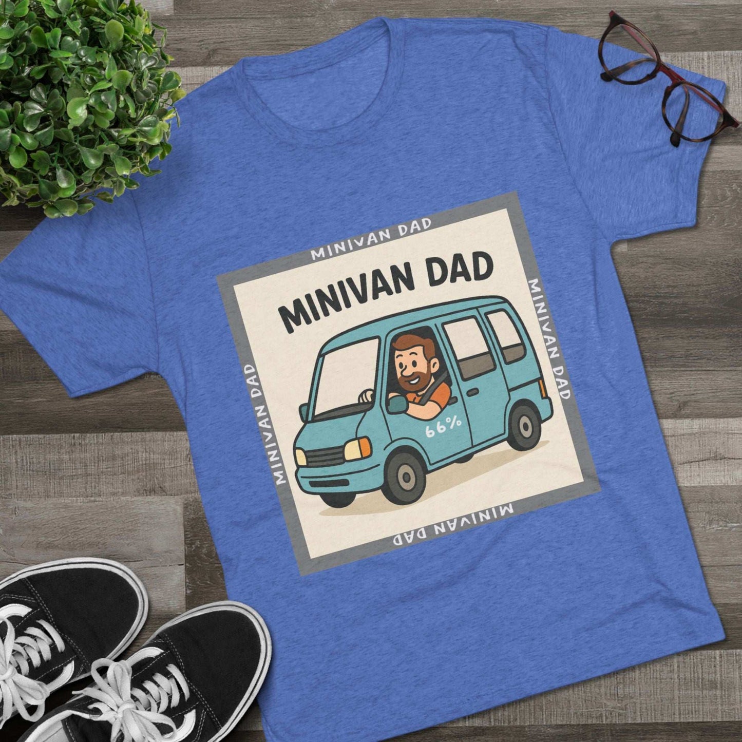 Minivan Dad 66% Tri-Blend Tee — graphic tee flat-lay, cartoon dad driving blue minivan, ‘66%’ decal, gray ‘MINIVAN DAD’ square border, casual unisex style.
